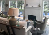 Thumbnail 22 of 36 - Leasing Office with Fire Place and Chandelier  at Huntington Apartments, North Carolina