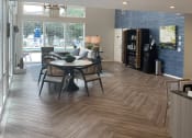 Thumbnail 21 of 36 - Leasing Office with view of Coffee Station and Seating  at Huntington Apartments, Morrisville