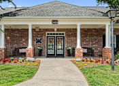 Thumbnail 12 of 46 - A building with a black door and a sign that says 2425.