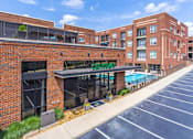 Thumbnail 1 of 26 - Image of Greenway Entrance with Pool to the Side at Greenway at Fisher Park, Greensboro, NC, 27401