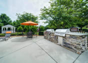 Thumbnail 16 of 20 - Umbrella Tables with Gas BBQ Grills adjacent to Pool Area and Gazebo