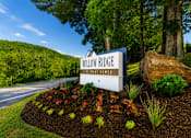 Thumbnail 15 of 21 - A sign for Willow Ridge is in front of a large tree.
