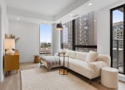 Thumbnail 27 of 59 - a living room with a white couch and a large window