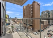Thumbnail 13 of 59 - a balcony with a view of a city street and buildings