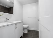 Thumbnail 22 of 59 - an empty bathroom with a toilet and a sink