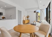 Thumbnail 56 of 59 - a living room and dining room with a table and chairs