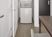 Thumbnail 21 of 46 - a small room with a refrigerator and a washing machine in it