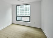 Thumbnail 42 of 46 - an empty room with white walls and a window