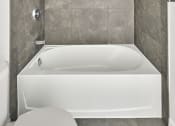 Thumbnail 36 of 46 - a bathroom with a white tub and a toilet