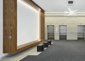 Thumbnail 39 of 46 - a lobby with four elevators and a white screen on the wall