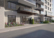 Thumbnail 3 of 12 - A modern building with the name "Magnolia Square" on the front entrance