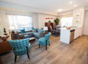 Thumbnail 4 of 11 - a living room and kitchen in an apartment
