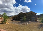 Thumbnail 2 of 26 - Front of Property With Blue Skies at Moenave Townhomes in Springdale, Utah