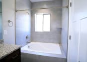 Thumbnail 19 of 26 - Bathroom With Shower/Bathtub With Plenty of Natural Light at Moenave Townhomes in Springdale, Utah
