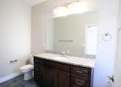 Thumbnail 18 of 26 - Bathroom With Large Mirror, Marble Counters, Light Fixture at Moenave Townhomes in Springdale, Utah