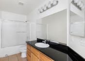 Thumbnail 23 of 49 - Bathroom with Basin and mirror at Lotus Villas, California, 93312