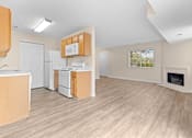 Thumbnail 9 of 22 - A kitchen with wooden cabinets and a white fridge.