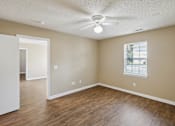 Thumbnail 12 of 14 - Empty room with a ceiling fan and a window.