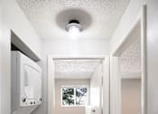 Thumbnail 7 of 15 - an empty laundry room with a washer and dryer