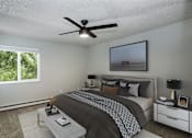 Thumbnail 2 of 15 - the master bedroom has a large bed and a ceiling fan