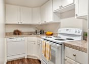 Thumbnail 15 of 22 - Efficient kitchen layout with generous storage and convenient access to the dining area.