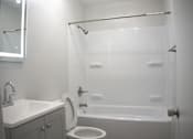 Thumbnail 46 of 51 - a small bathroom with a shower toilet and sink