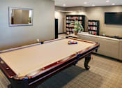 Thumbnail 2 of 13 - You can play pool in the media room, or grab a book from our library.