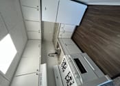 Thumbnail 6 of 10 - White kitchen cabinets and luxury vinyl planking