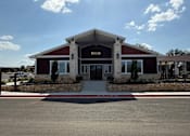Thumbnail 1 of 56 - A building with a red roof and a sign that says "ARIZONA" on it.