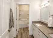 Thumbnail 35 of 56 - A bathroom with a towel hanging on the door.