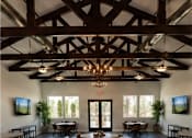 Thumbnail 52 of 56 - A large room with a wooden floor and a chandelier hanging from the ceiling.