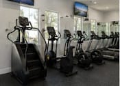 Thumbnail 53 of 56 - A gym with treadmills and exercise bikes.