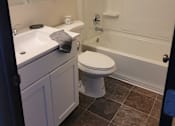 Thumbnail 10 of 10 - a bathroom with a bathtub toilet sink and mirror