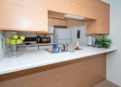 Thumbnail 13 of 23 - Fully Furnished Kitchen at Wheeler Estates Apartments, Decatur, Alabama