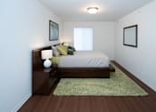 Thumbnail 6 of 13 - A bedroom with a bed, nightstand, and two pictures on the wall.