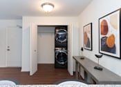 Thumbnail 5 of 13 - A room with a washing machine and dryer in it.
