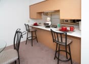Thumbnail 9 of 21 - Kitchen Bar at Boggan Estates Apartments in Tupelo, MS