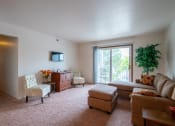 Thumbnail 9 of 23 - Carpeted Living Room at Custer Estates Apartments, Michigan, 48162