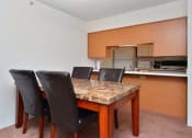 Thumbnail 20 of 27 - Well Equipped Kitchen And Dining at Ross Estates Apartments, MRD Conventional, Oklahoma