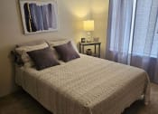Thumbnail 22 of 22 - a bedroom with a bed and some pillows on it