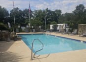 Thumbnail 20 of 22 - a swimming pool with a railing on the side of it