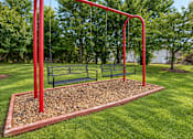 Thumbnail 10 of 10 - A red swing set with a red pole and a red frame.