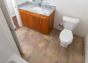 Thumbnail 9 of 12 - Bathroom with Vanity Lights at Gray Estates Apartments, MRD Conventional, St Clair MI 48079
