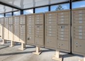 Thumbnail 16 of 17 - A series of mailboxes are lined up outside in the sunshine.