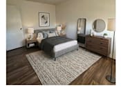 Thumbnail 3 of 4 - A bedroom with a bed, nightstands, and a dresser.