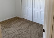 Thumbnail 7 of 9 - a room with carpet and two closet doors