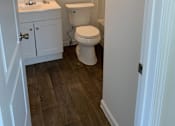 Thumbnail 9 of 9 - a small bathroom with a toilet and a sink