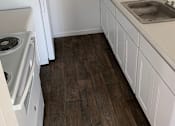 Thumbnail 2 of 9 - a kitchen with a stove and a refrigerator and a sink