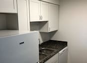 Thumbnail 9 of 15 - a kitchen with a sink and a dishwasher