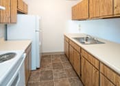 Thumbnail 8 of 8 - a kitchen with a stove sink and refrigerator